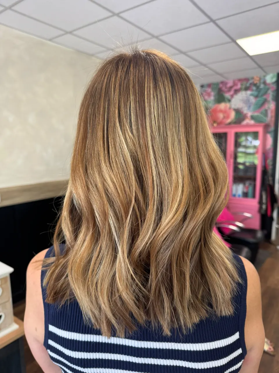 Mid-length lived-in balayage with soft waves, coloured in Horsham