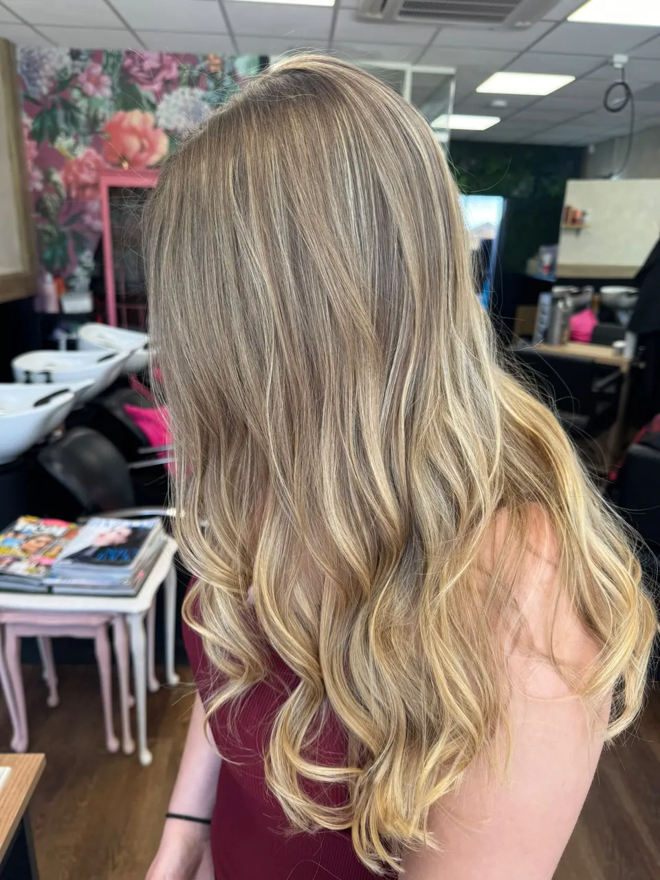 Long light-blonde hair styled in soft curls